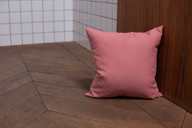 a-pink-pillow-on-the-floor