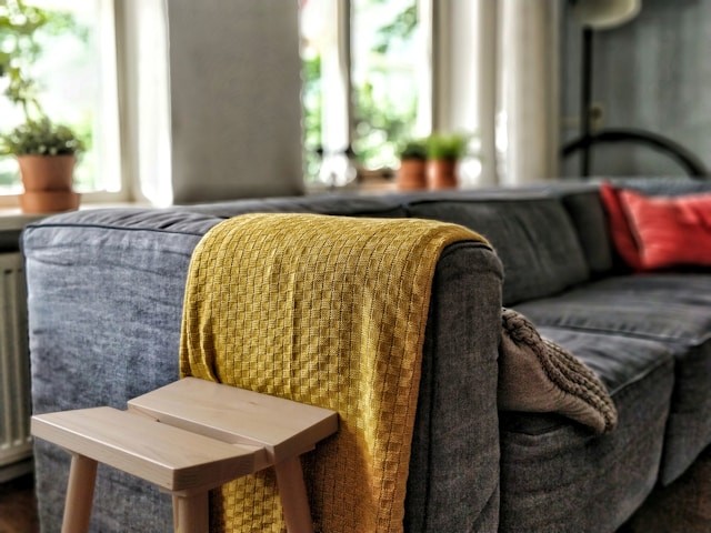 yellow-textile-on-couch